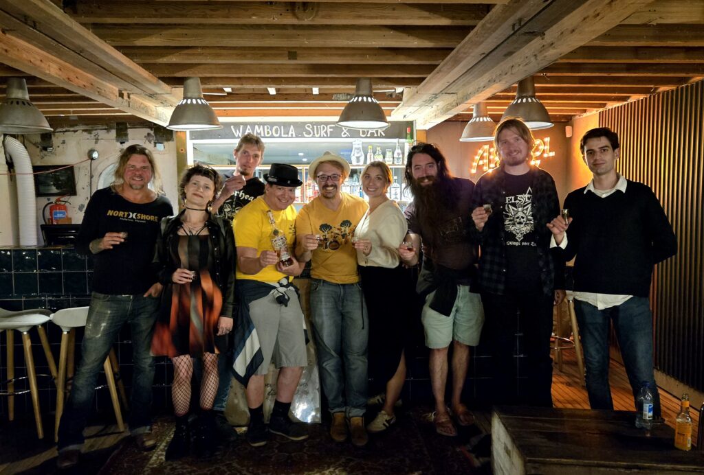 Band, author, and others at Wambola Surf & Bar after the show.