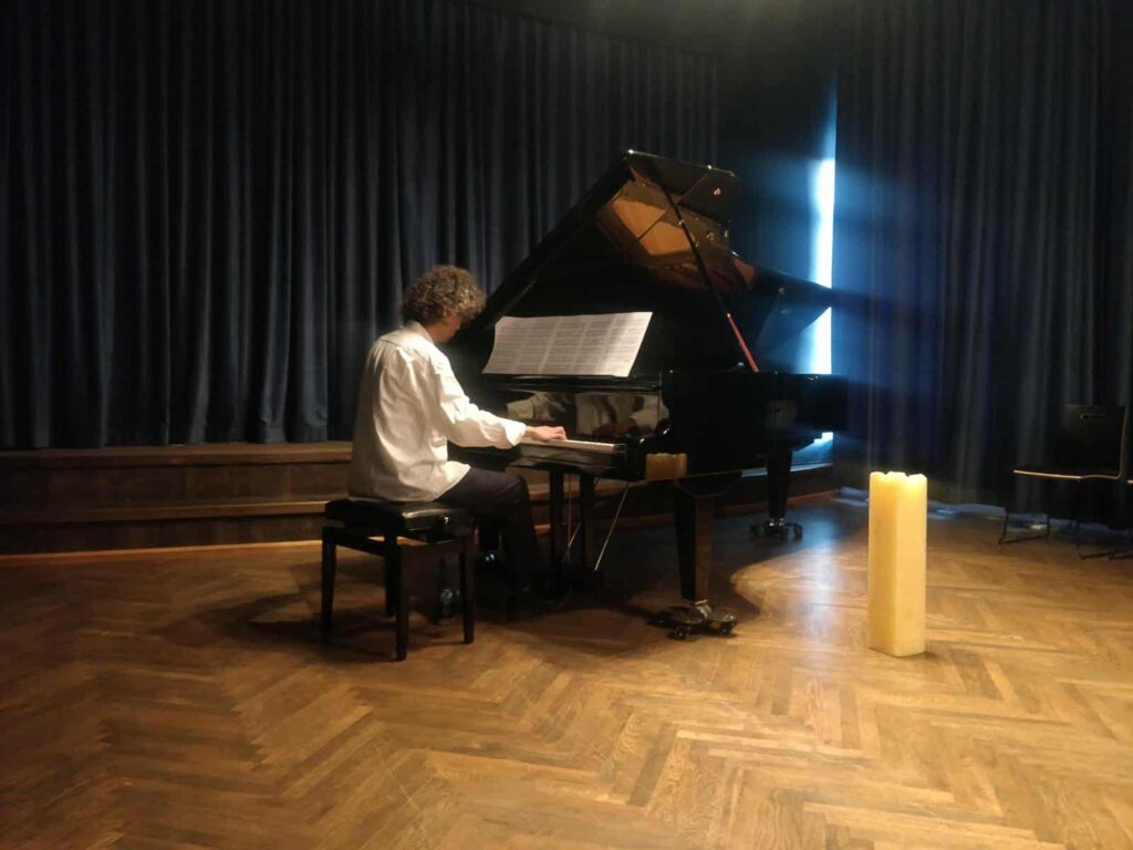 Arashk Azizi at the piano in Divine Sonata.