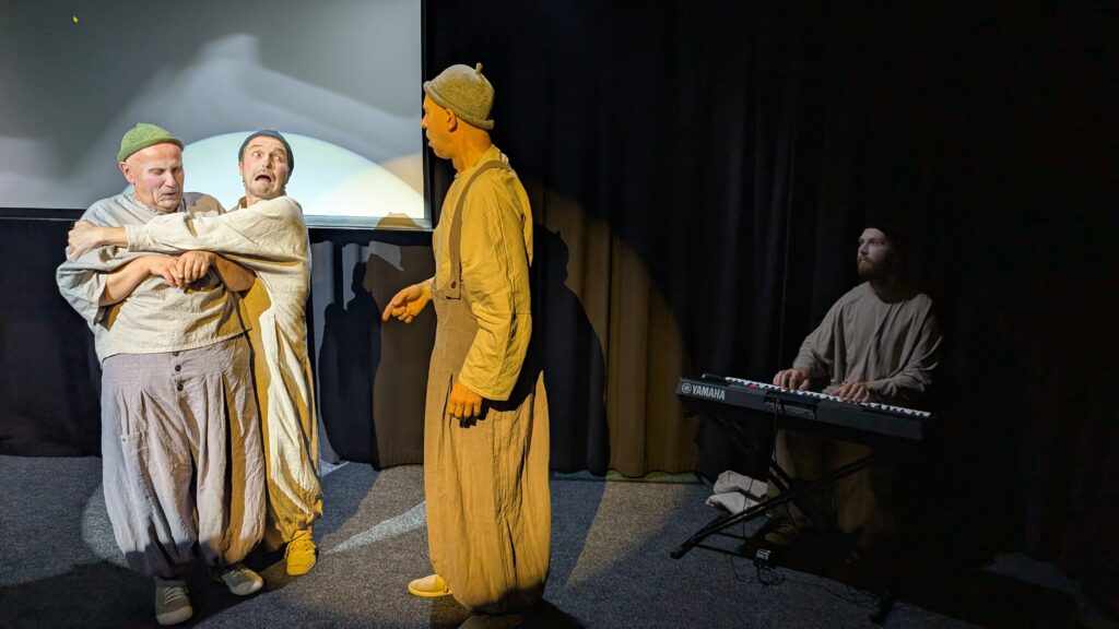 Actors Erki Aule, Tarvo Krall and Rauno Kaibiainen, and pianist Madis Kreevan, in Improv Comedy in Gibberish at IMPEERIUM Improteater, Tallinn Fringe Festival 2026.