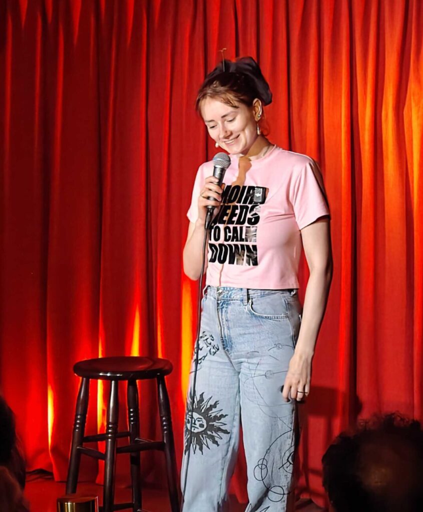 Moira on stage during Indian Auntie Goes Dating, Tallinn Fringe Festival 2026.